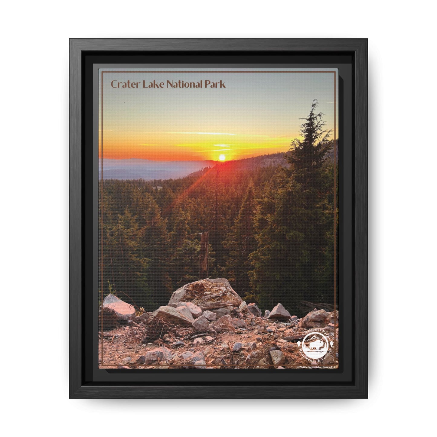 Black framed canvas print depicting a Majestic sunset over forested mountains at Crater Lake National Park.