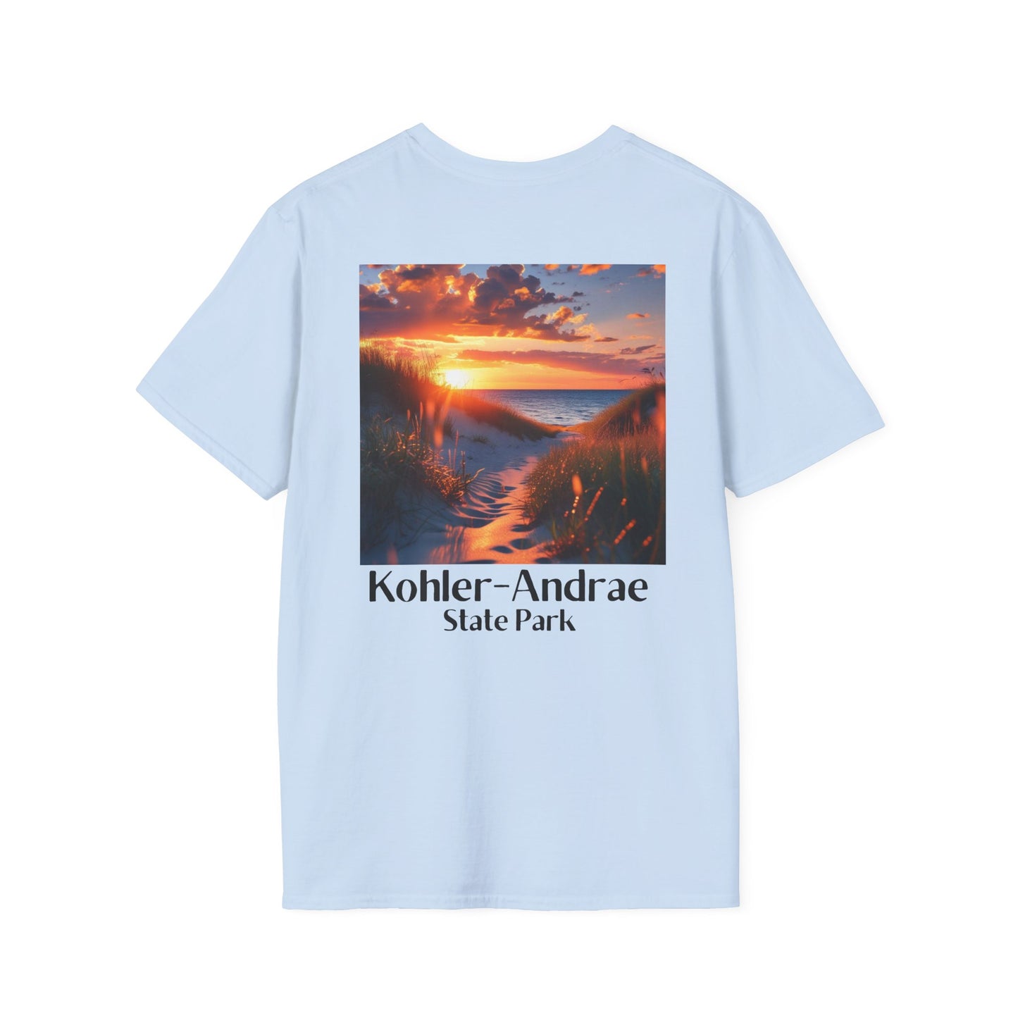 Light Blue T-shirt featuring a back design of looking through the sand dunes at a colorful sunrise over Lake Michigan and the text: Kohler-Andrae State Park.