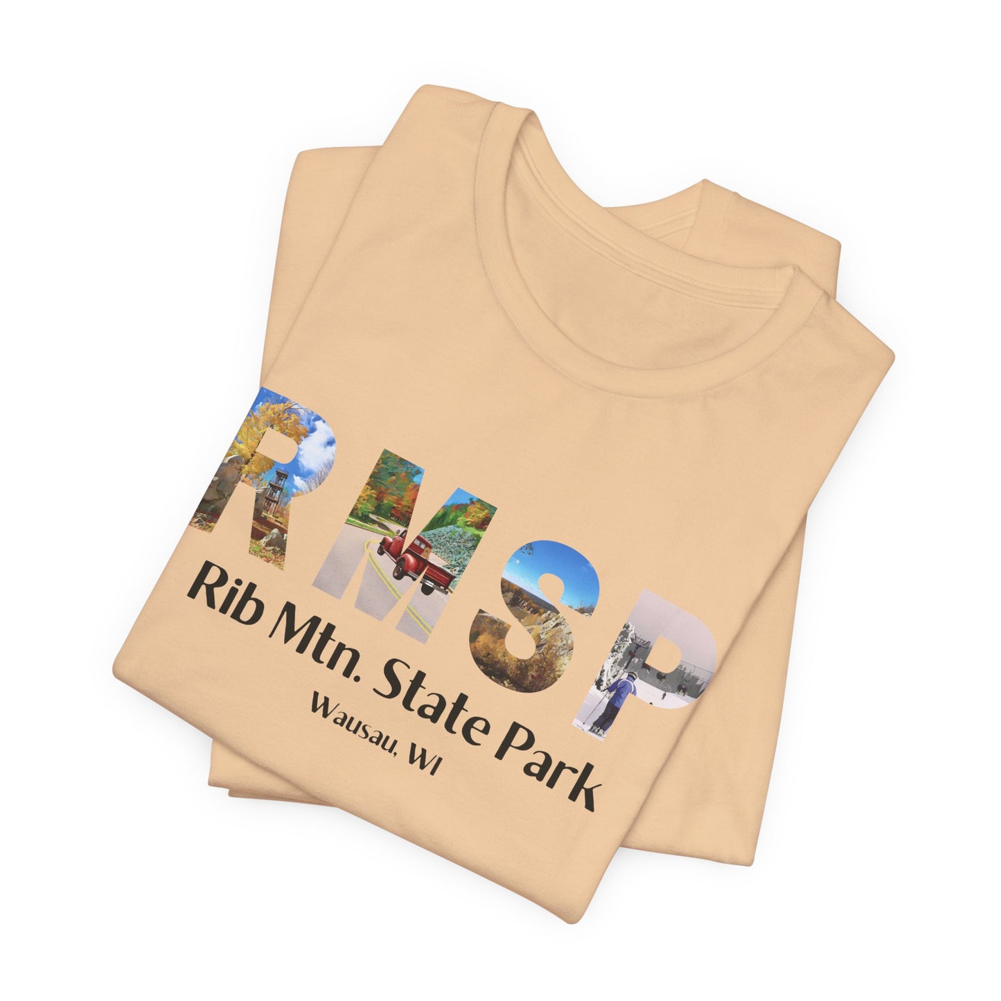 Folded RMSP shirt in sand dune color depicting the letters RMSP, each with a different park scene.