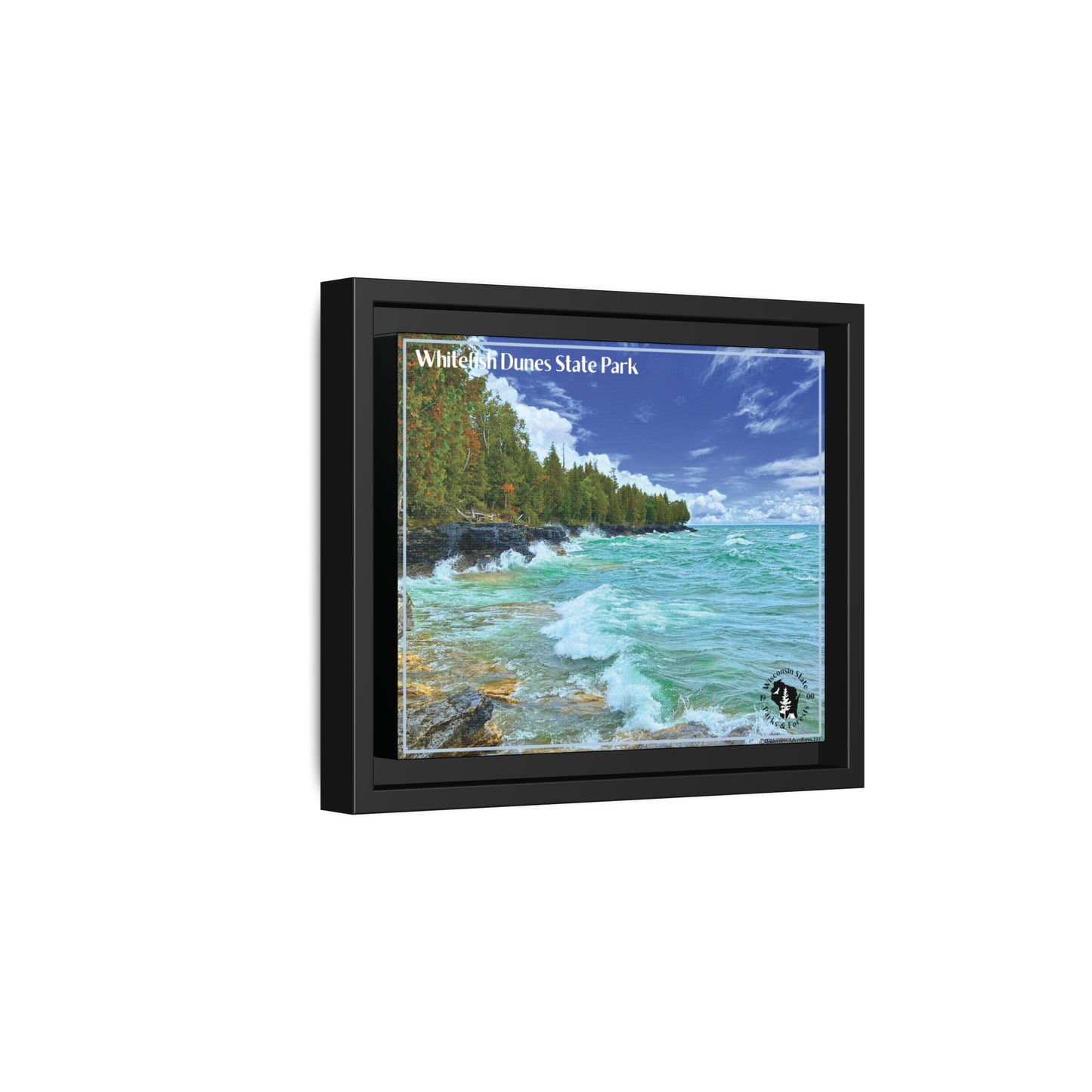Side profile view of Black framed canvas, print featuring large waves crashing against the rocky Shores of whitefish Dune State Park.