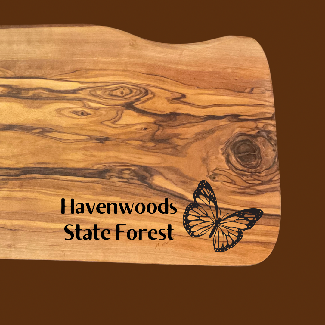 Olive wood serving board with the text “Havenwoods State Forest” and a butterfly icon.