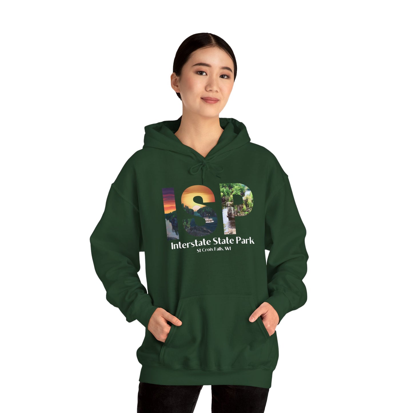 Female wearing a forest green colored hoodie featuring a ISP logo design with artistic prints and the text: Interstate State Park - St Croix Falls, WI”.