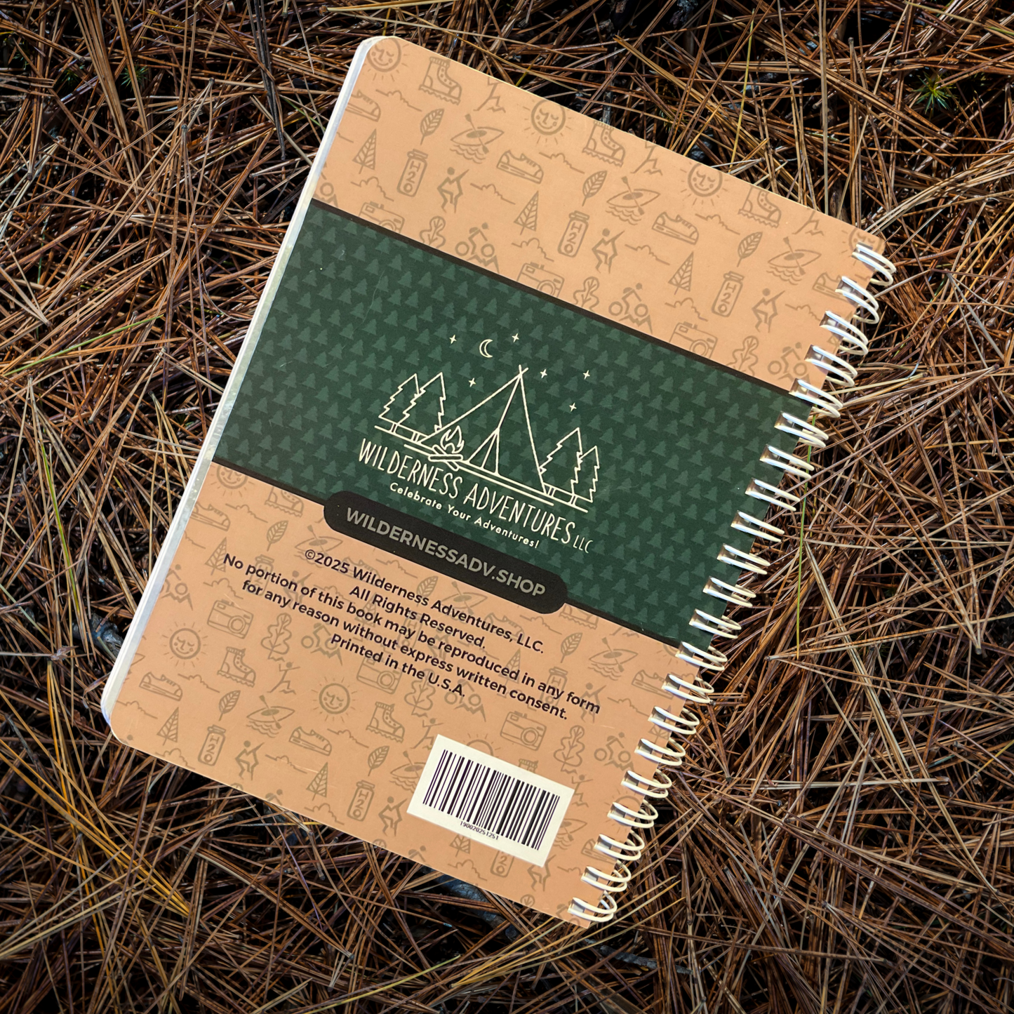 Wisconsin State Parks, Forests, and Trails Interactive Guide. Featuring a display of back cover of book. Photo background: book laying on a bed of pine needles.