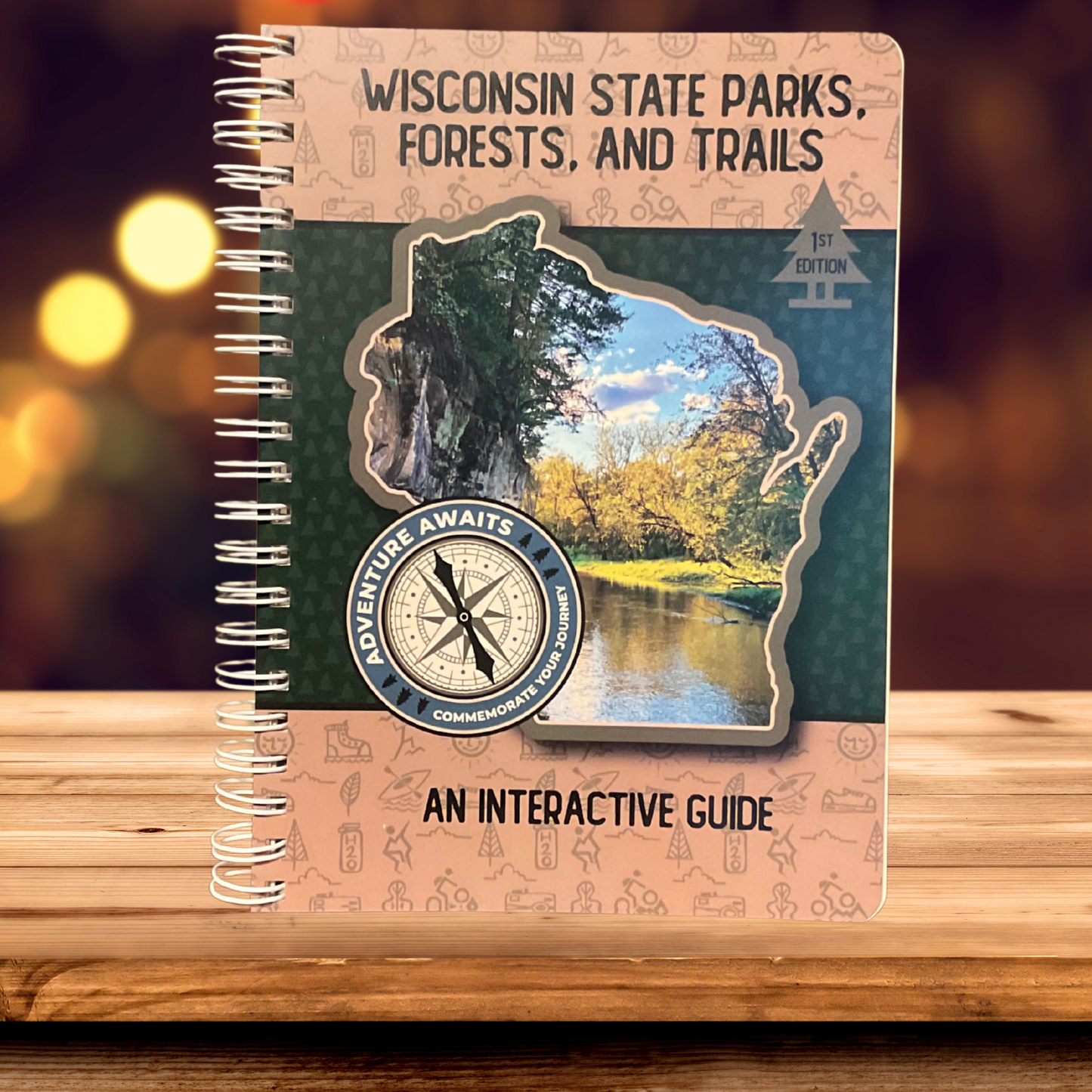 Wisconsin State Parks, Forests, and Trails Interactive Guide. Photo Background: Book sitting on a wood table top.