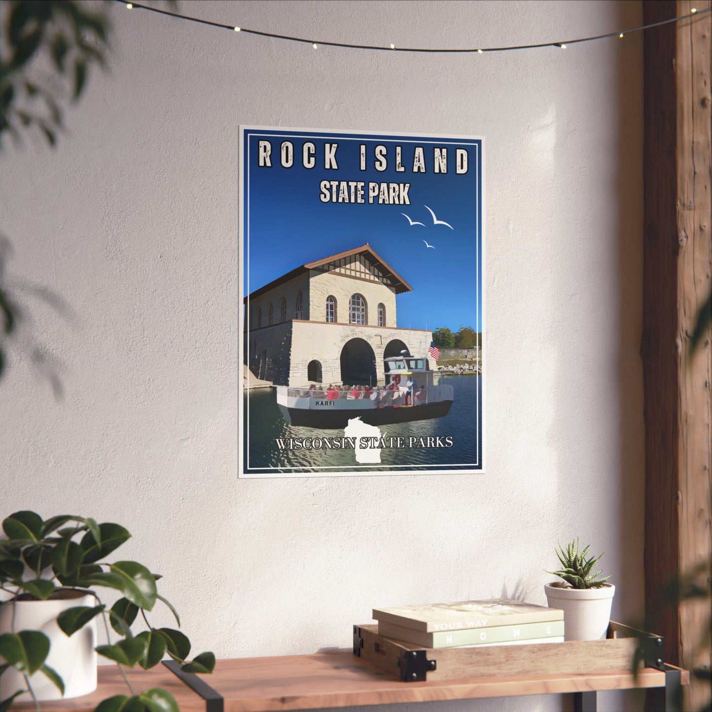 Vintage style poster depicting the Rock Island State Park boathouse and the Karfi passenger ferry. Photo background: poster hanging on a wall above a shelf with books and plants.