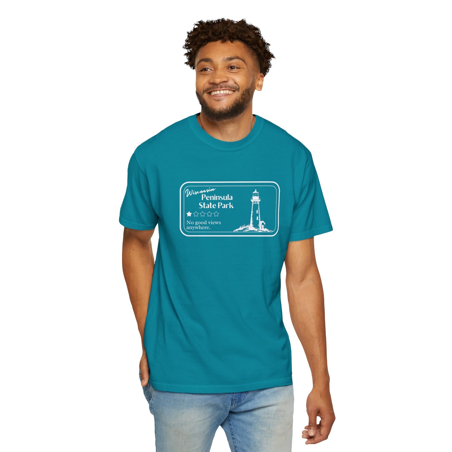 Male model wearing a Topaz Blue colored T-Shirt with 1 star review design of Peninsula State Park. Features a line art image of a lighthouse, 1 star graphic, and the text: “Wisconsin Peninsula State Park, No good views anywhere.