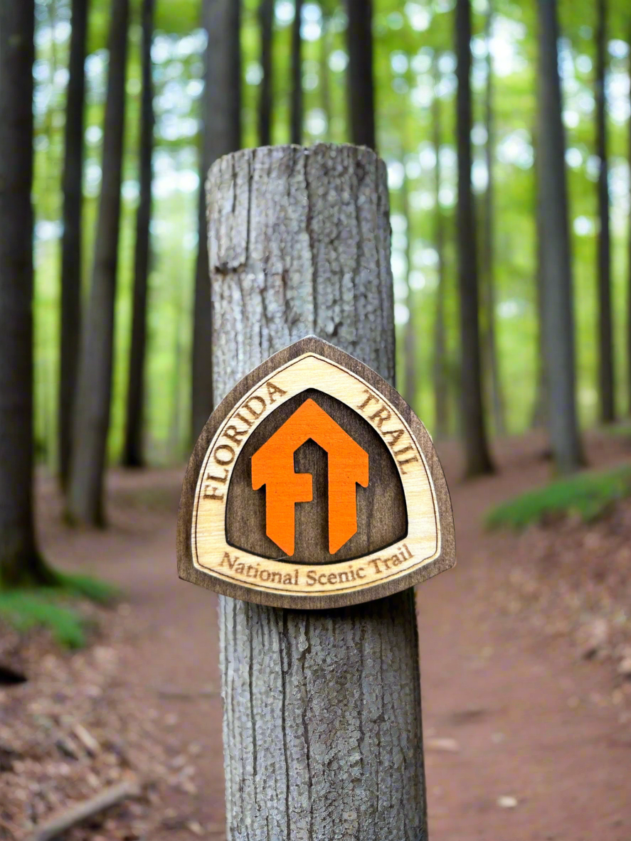 National Trail Symbol with the text "Florida Trail National Scenic Trail" and an orange "FT" symbol.