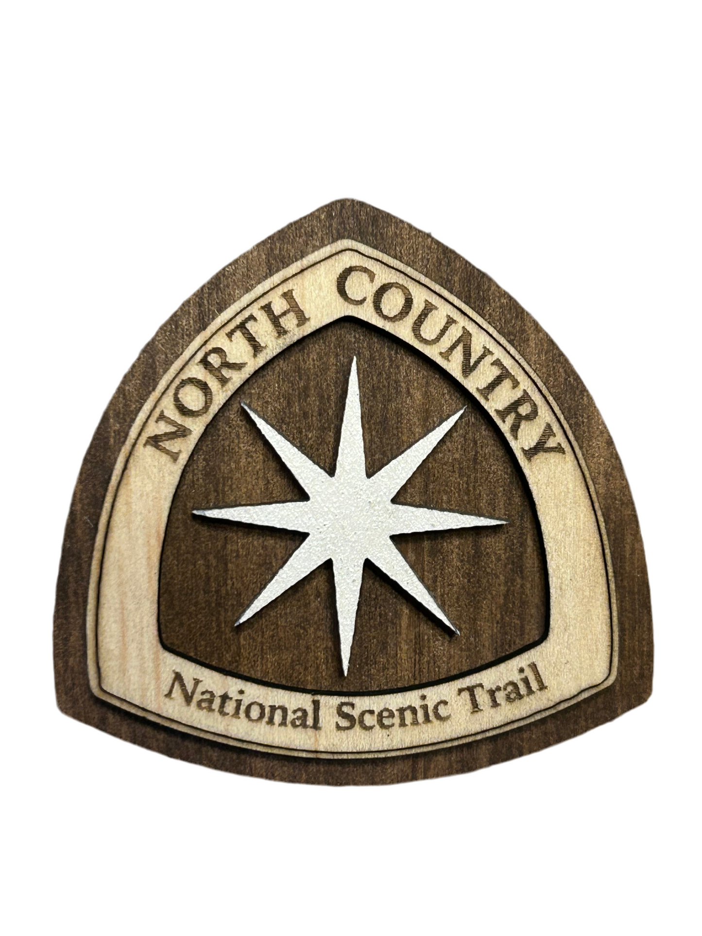 National Trail Icon with Text "North Country National Scenic Trail" and a White Polaris Star Icon on a walnut-colored background.
