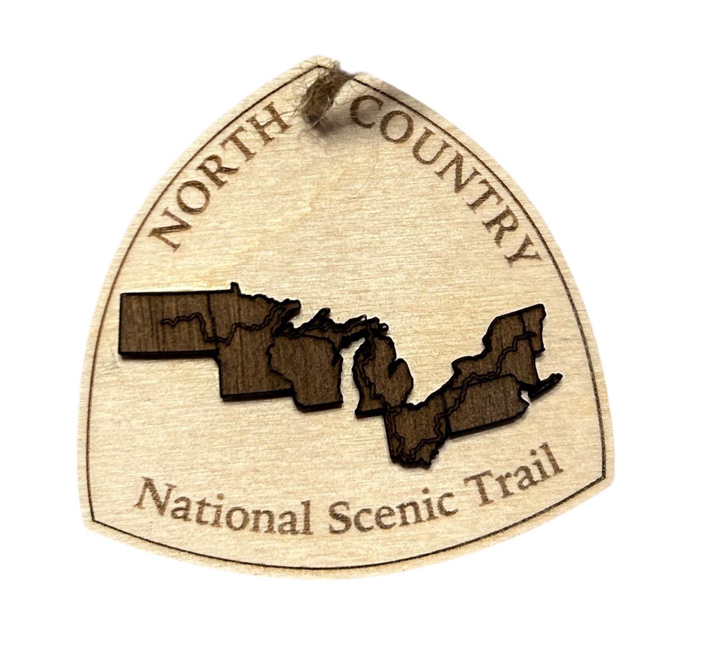 Wood ornament in the shape of the national trail's icon, with a walnut-colored North Dakota, Minnesota, Wisconsin, Michigan, Ohio, Pennsylvania, New York, and Vermont Shaped center piece depicting the North Country Trail Route. Ornament contains the text "North Country National Scenic Trail".