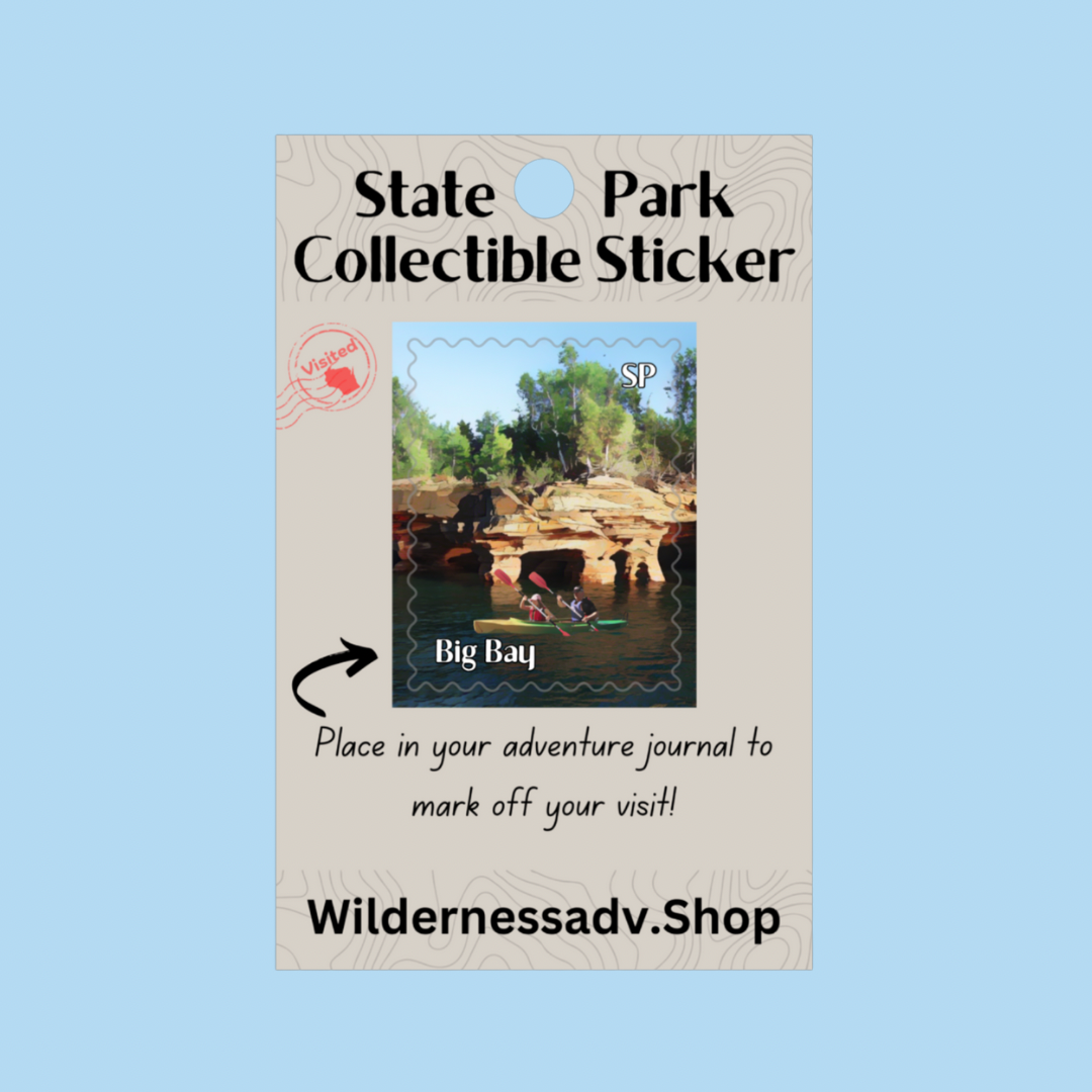 Sticker for Wisconsin State Park Adventure Journal depicting two kayakers paddling on Lake Superior along cliffs and sea caves.