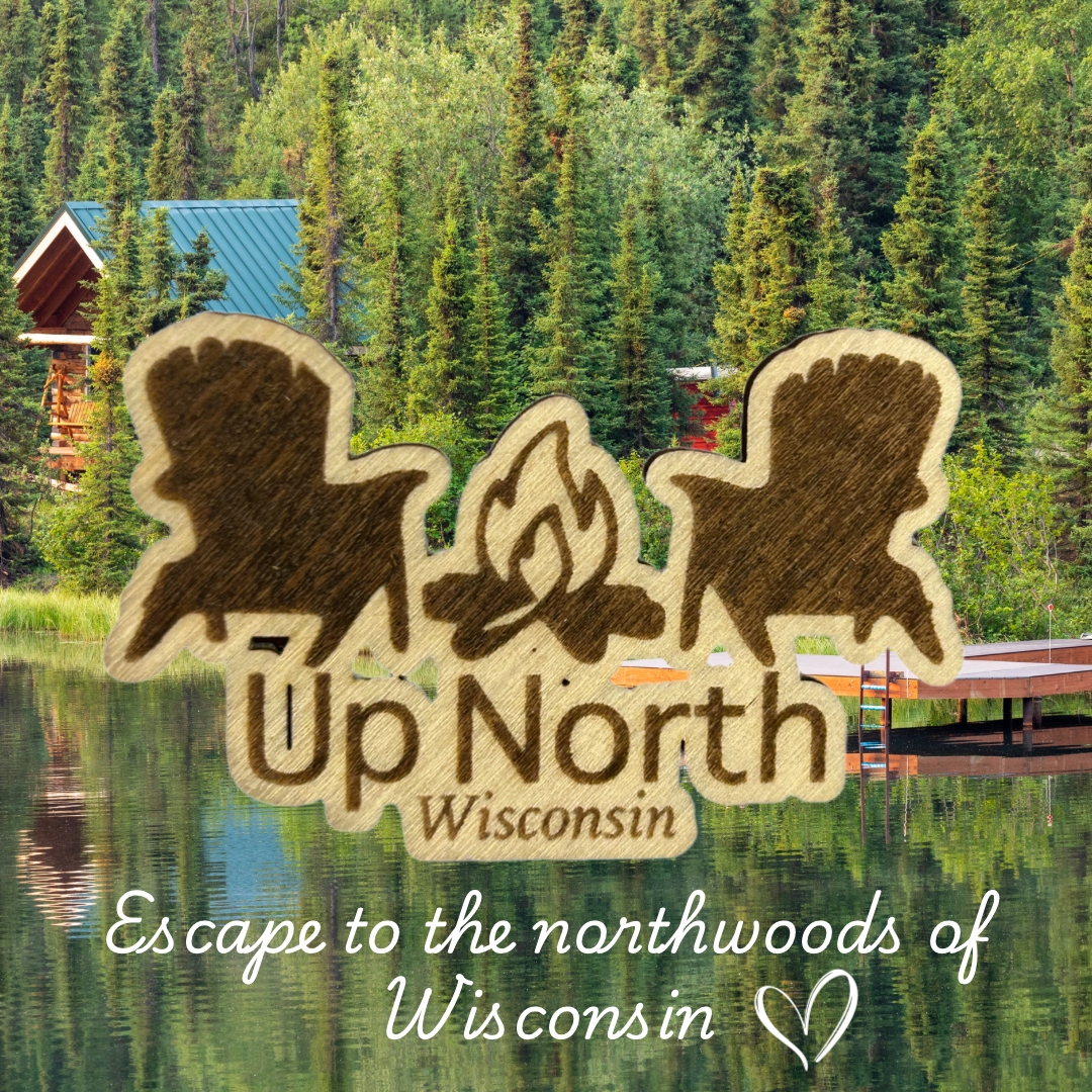 Wood magnet in the shape of two Adirondack chairs and a campfire pictured against a cabin and lake backdrop.