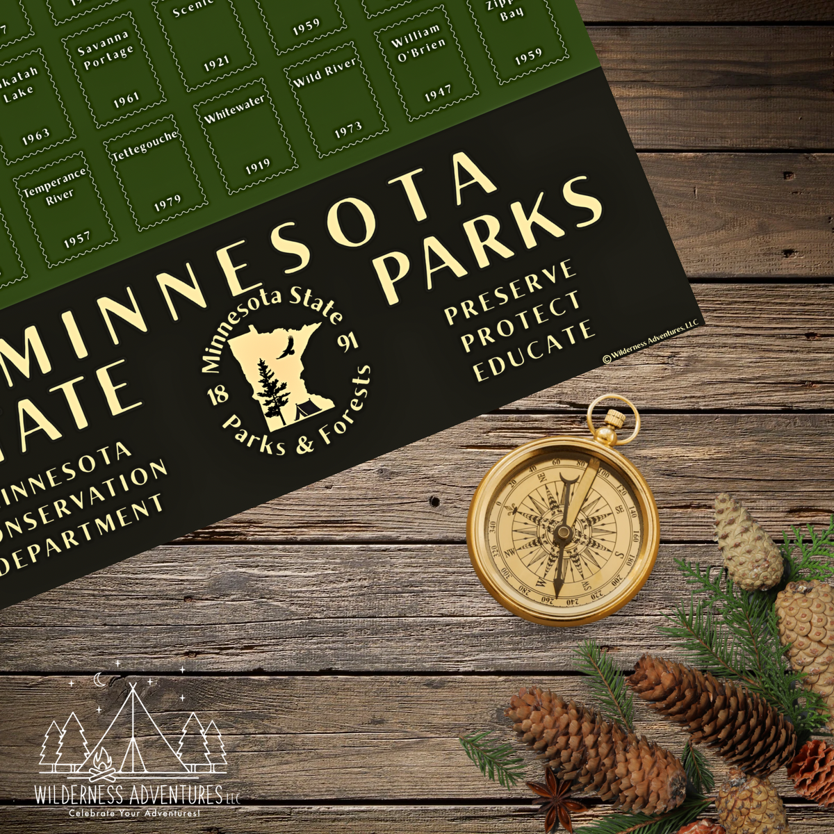 A Minnesota State Parks poster laid on a rustic wooden surface, styled with a gold compass, pinecones, evergreen branches, and a small Wilderness Adventures logo in the corner.