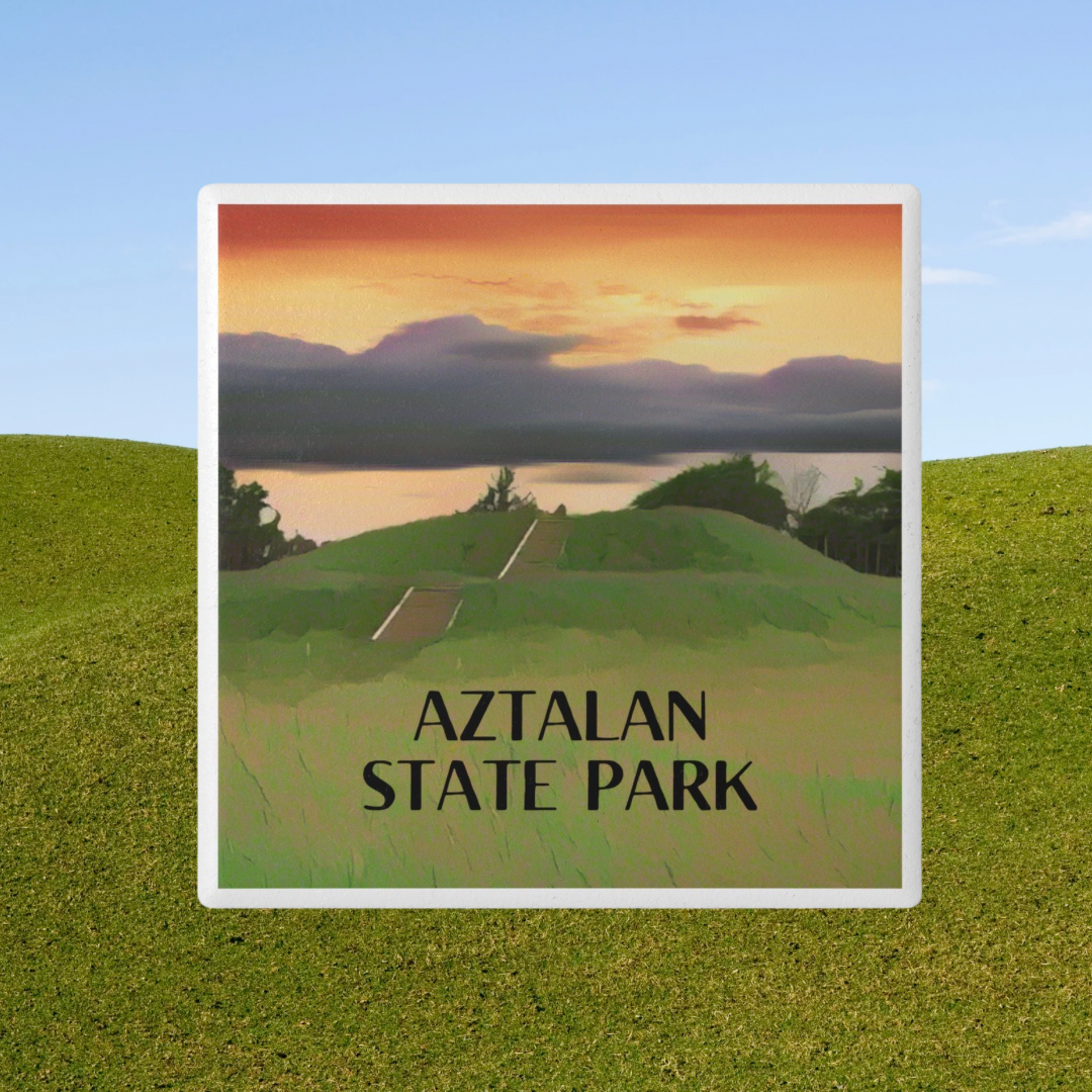 Coaster depicting a pyramid shaped mound and the text “Aztalan State Park.” Photo background: rolling green hills.