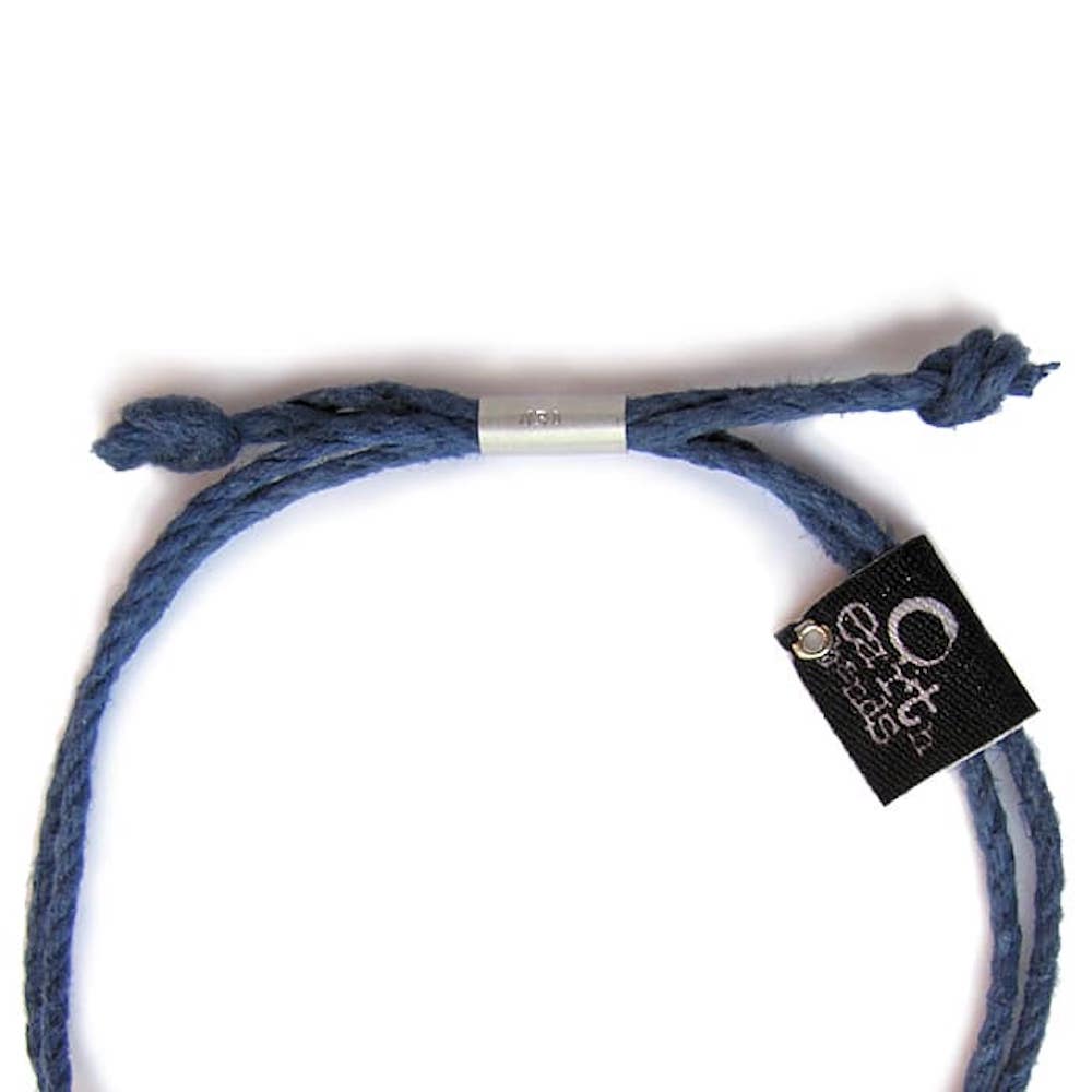 Blue braided bracelet with a black tag on a white background