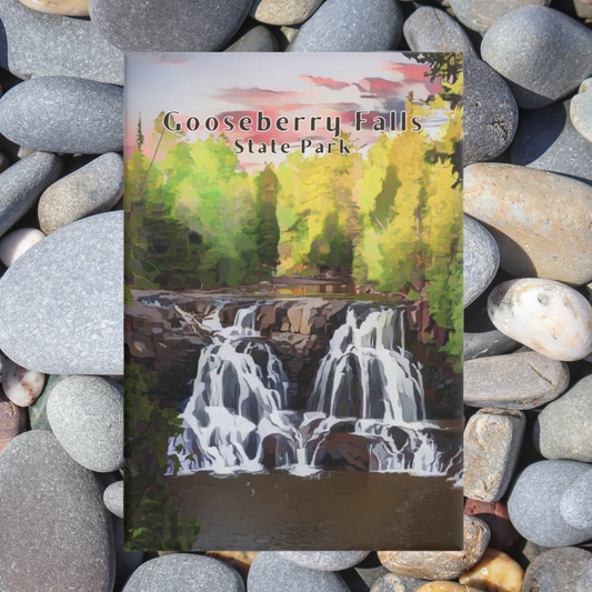 Magnet of Gooseberry Falls State Park with a waterfall and trees on pebbles.