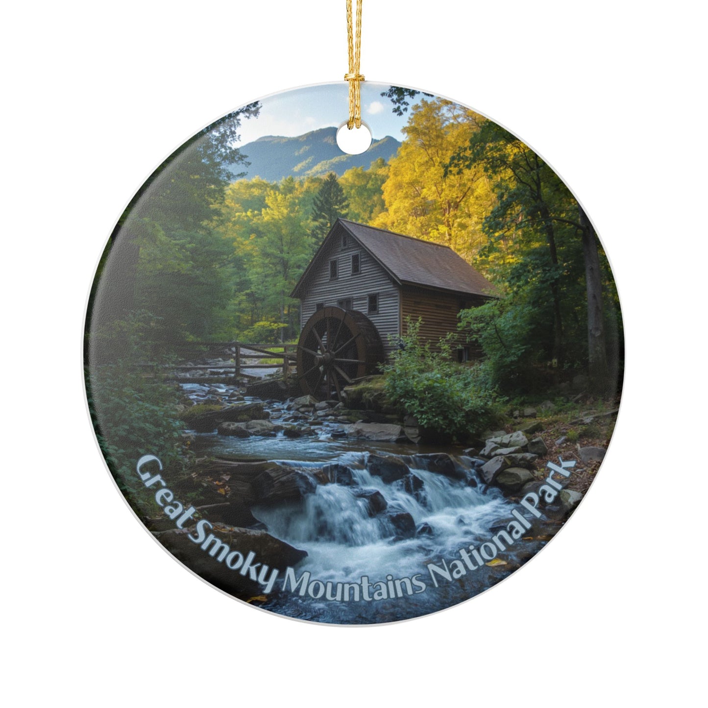 Round ceramic ornament with a scenic view of a watermill in the Great Smoky Mountains National Park.