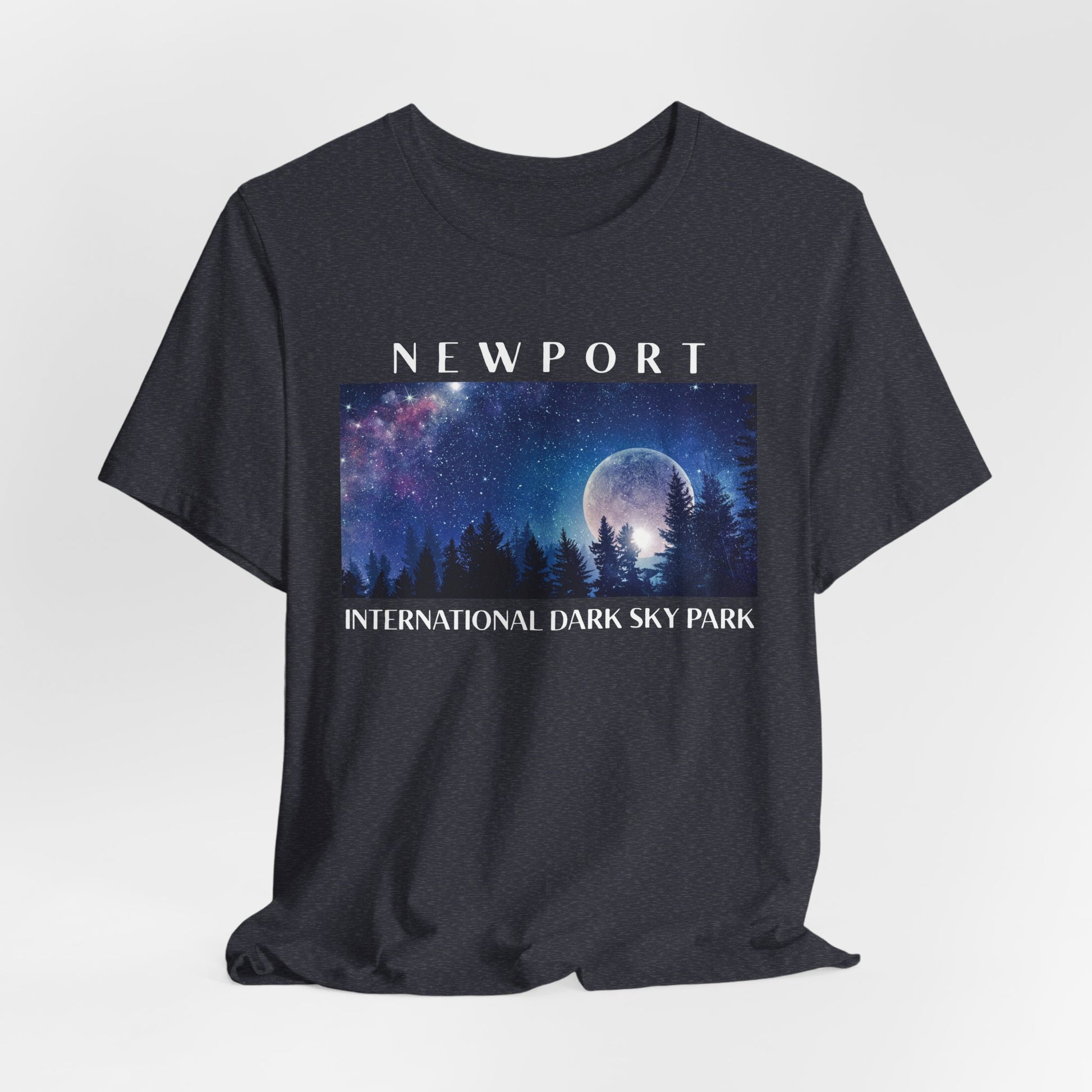 Heather Navy t-shirt with a graphic of a night sky over trees and 'Newport International Dark Sky Park' text.