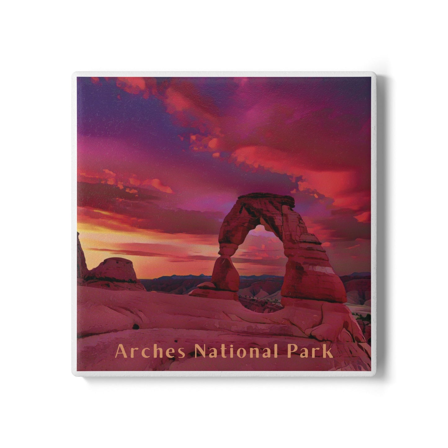 Ceramic coaster of Arches National Park with a sunset sky over a natural arch.