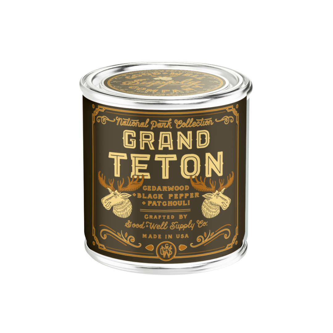 Grand Teton candle in a tin with decorative label on a white background