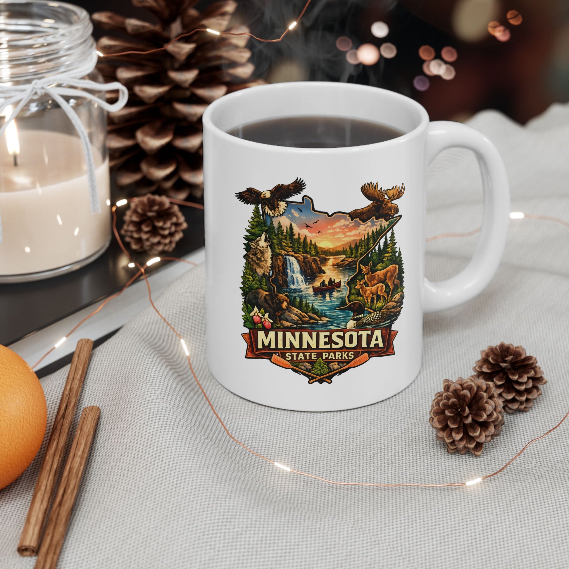 White mug with Minnesota State Parks design on a table with decorative items