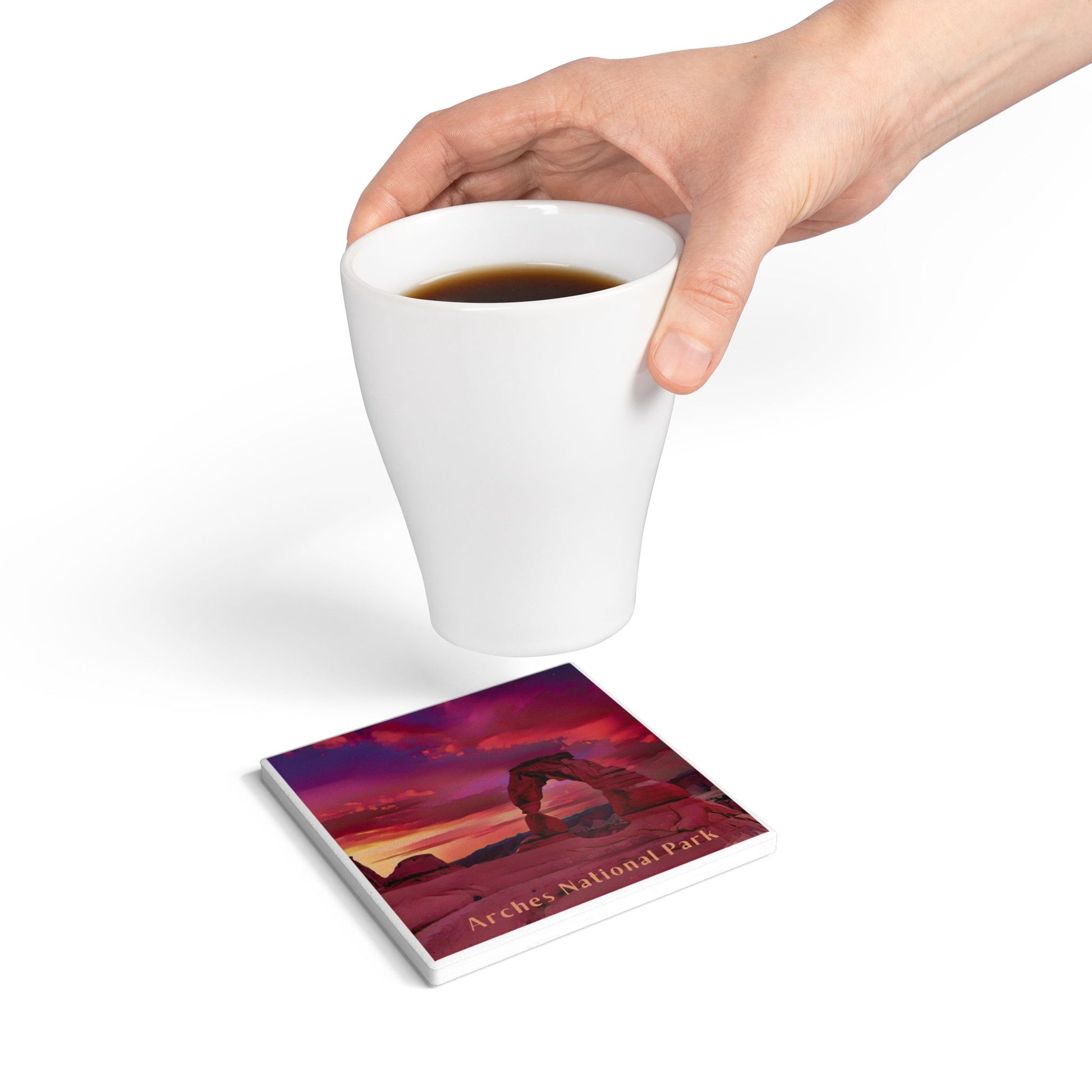 Coaster with Arches National Park design under a white cup of coffee