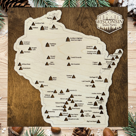 Map of Wisconsin state parks on a wooden board with decorative elements.