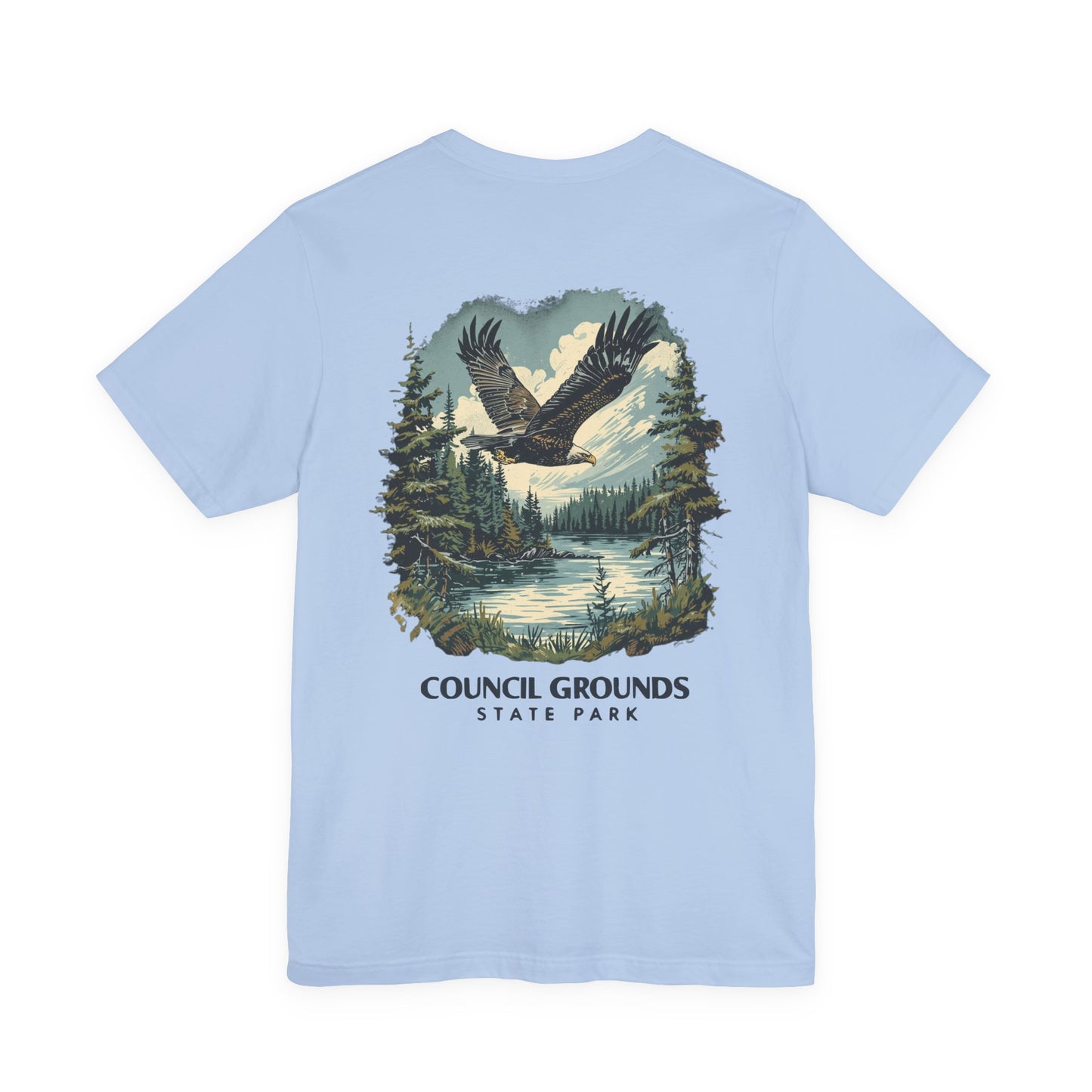 Light blue t-shirt with a eagle graphic and 'Council Grounds State Park' text on a white background