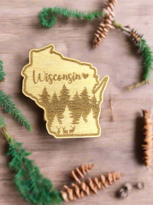 Wisconsin wood shaped magnet with deer and forest scene and text Wisconsin with heart symbol. 