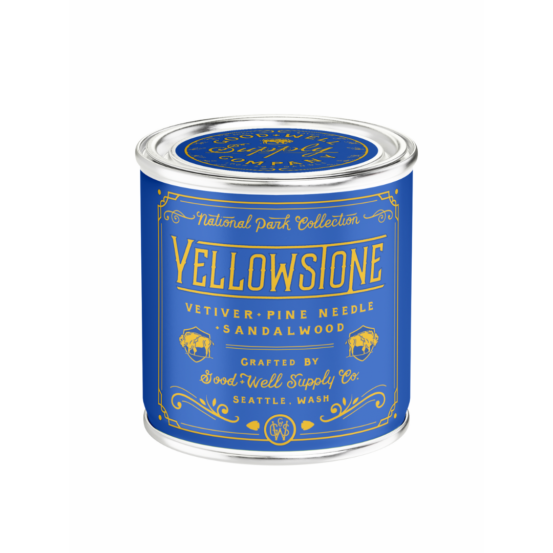 Candle canister labeled 'Yellowstone' with blue and yellow design on a white background