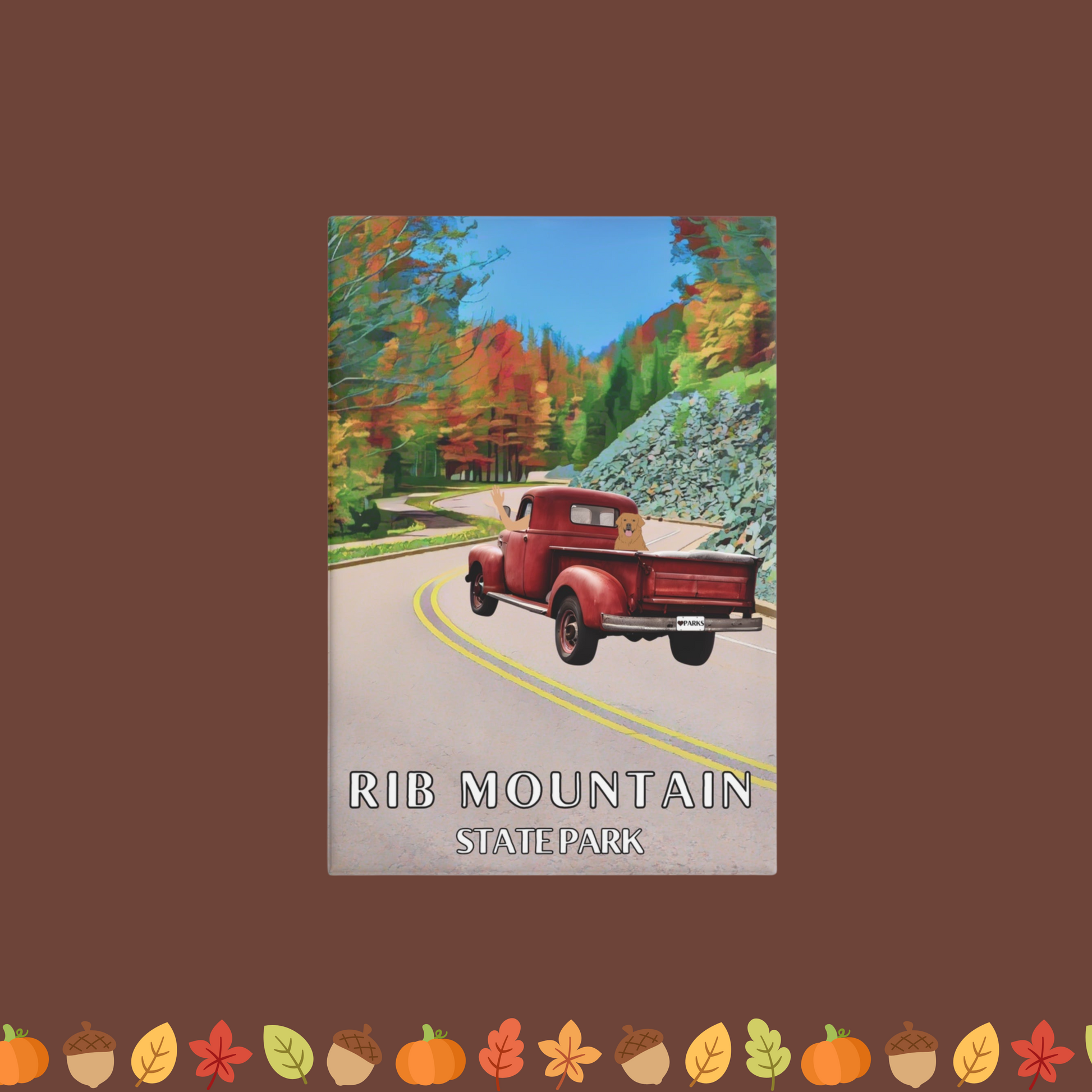 Button Magnet with a design featuring a vintage red truck driving up the enter ace road of Rib Mountain State Park lined with trees in fall color.  Photo Background: leaves, acorns, and pumpkins.