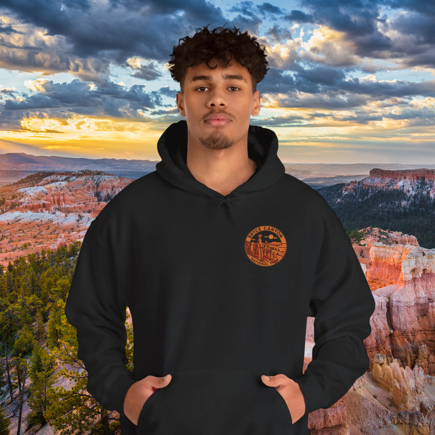 Person wearing a black hoodie with a Bryce Canyon National Park design in front of a scenic landscape