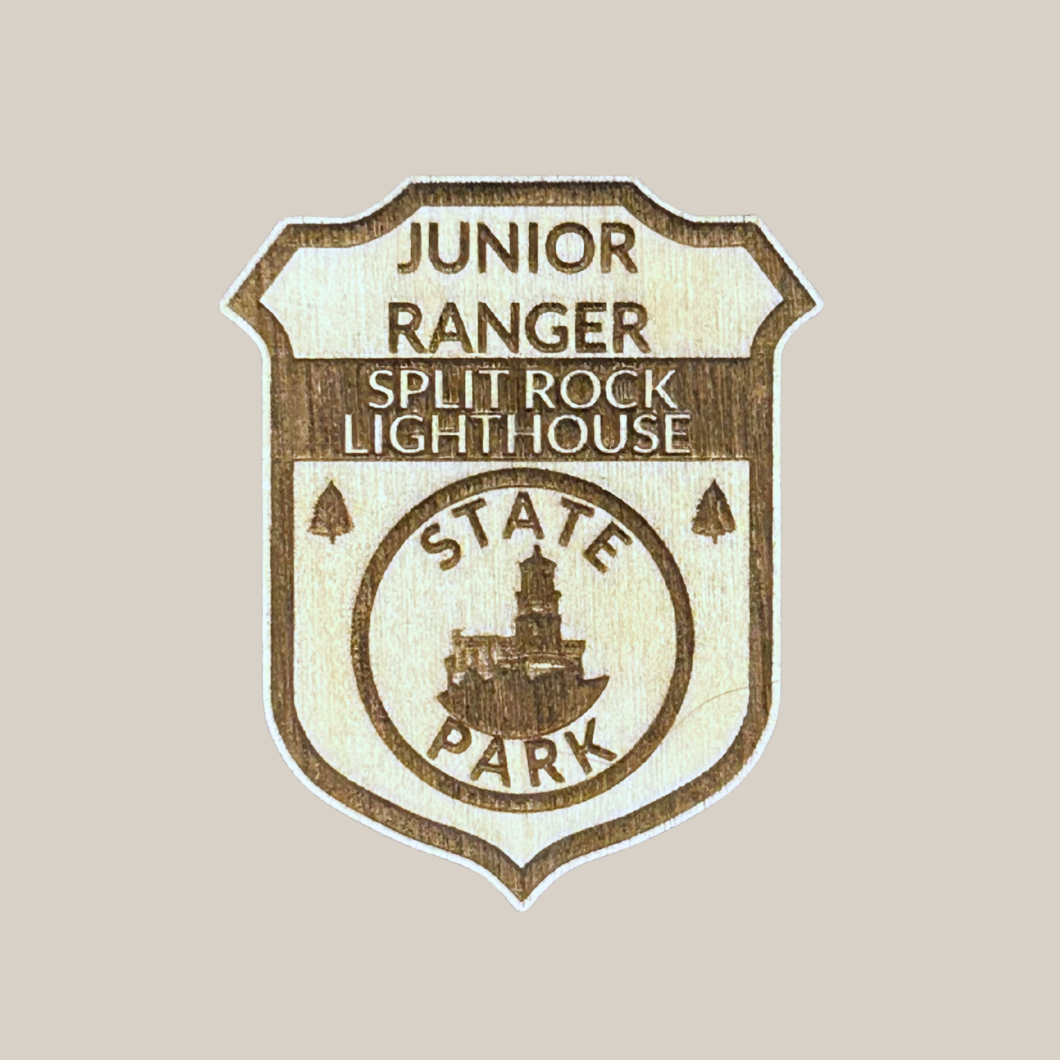 Junior Ranger badge for Split Rock Lighthouse State Park on a beige background