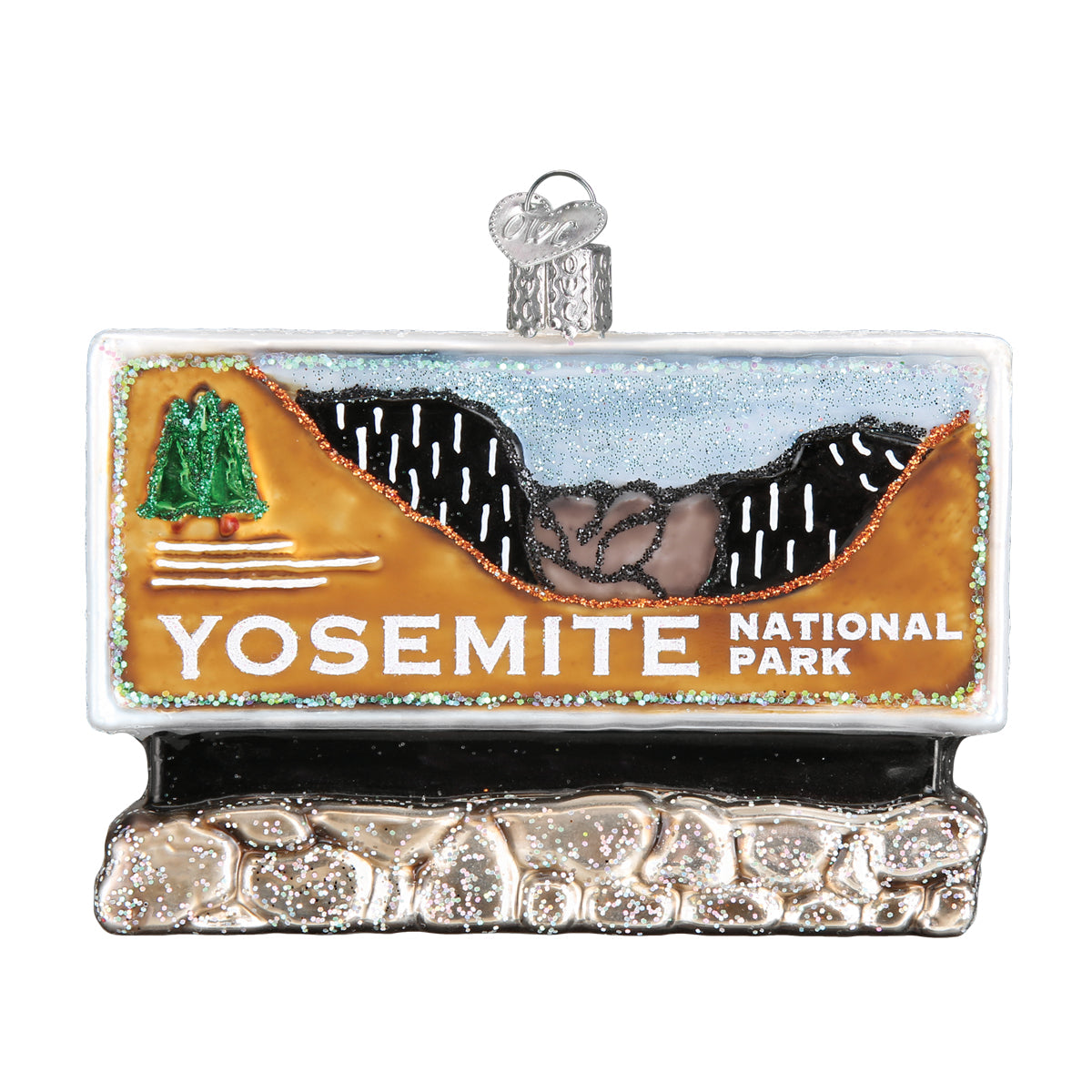 Hand painted glass ornament in the shape of Yosemite national park entrance sign on a white background.