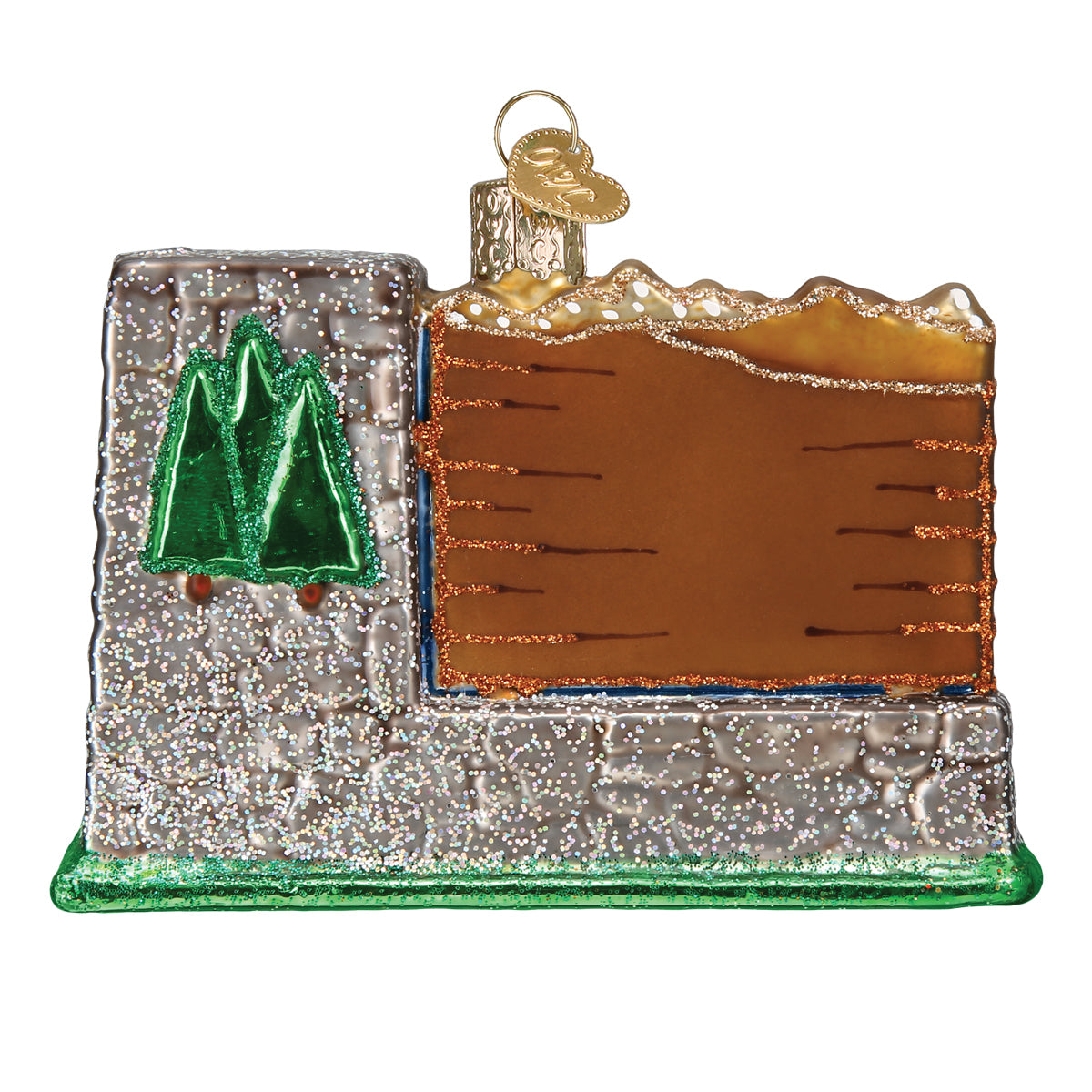 Rear view of 3-D glass ornament in the shape of the glacier national Park entrance sign against a white background