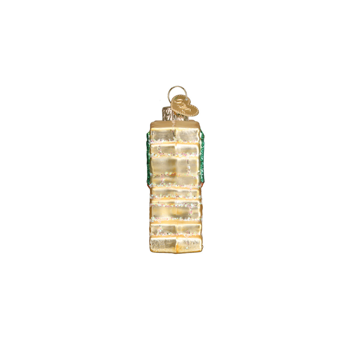 Side view of a 3-D glass ornament in the shape of the Grand Canyon national Park entrance sign against white background