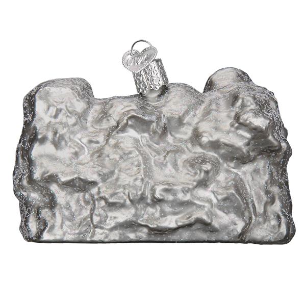 Back view of Glass ornament in the shape of Mount Rushmore on a white background.
