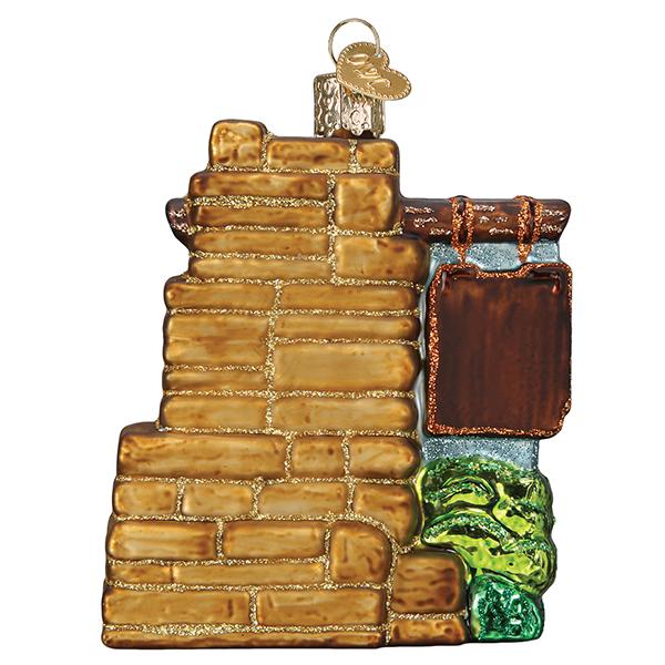 Back view of 3-D glass ornament in the shape of the Zion national park entrance sign on a white background.