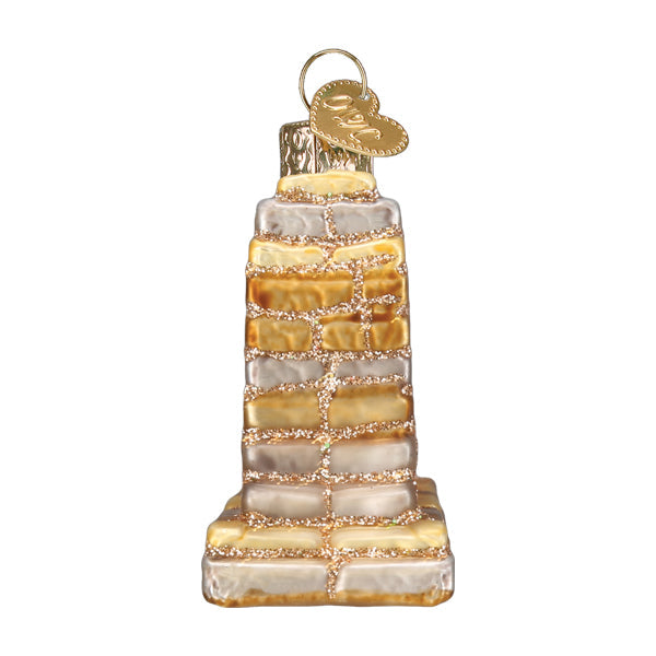 Side view of Handcrafted 3-D glass ornament in the shape of the Bryce Canyon national Park entrance sign on a white background.