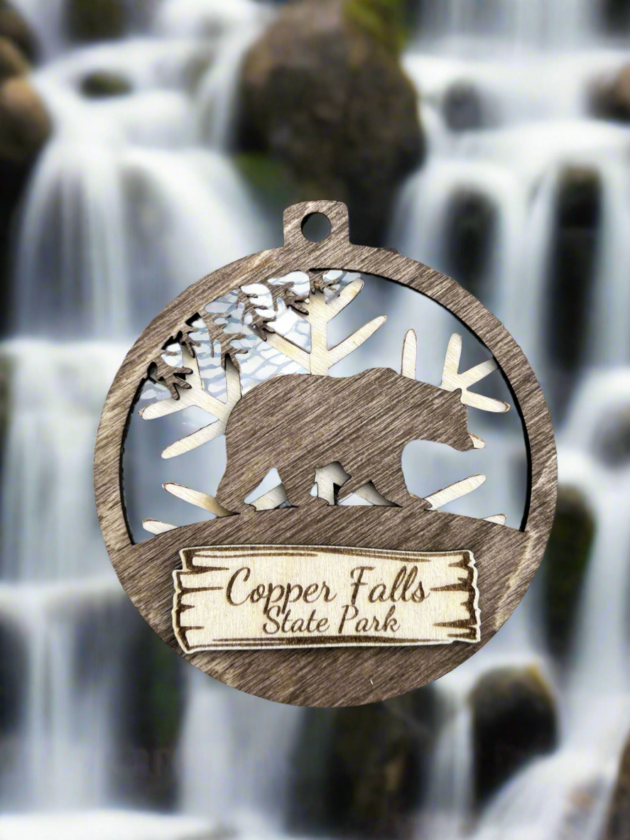 Wood Bear magnet with snowflake background and text "Copper Falls State Park".