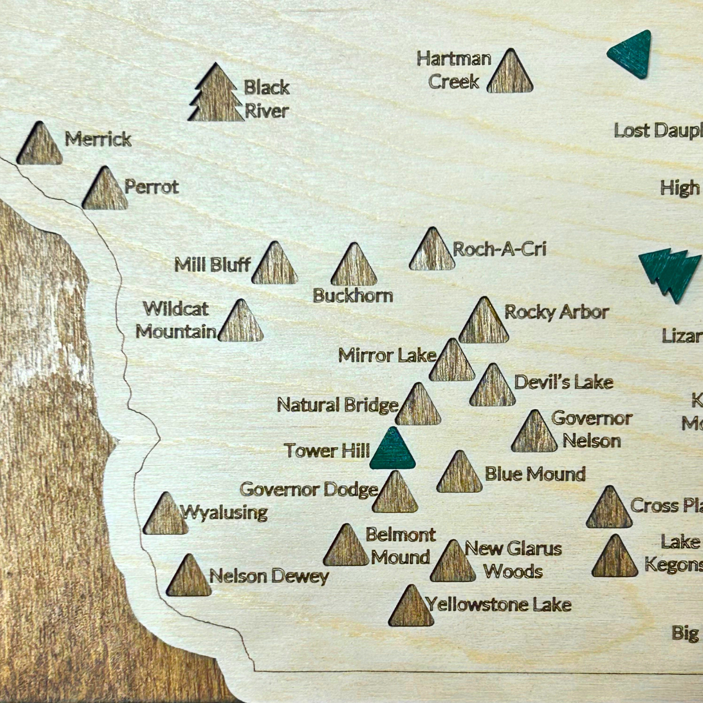 Wood map of Wisconsin State Parks and Forests with green wooden markers