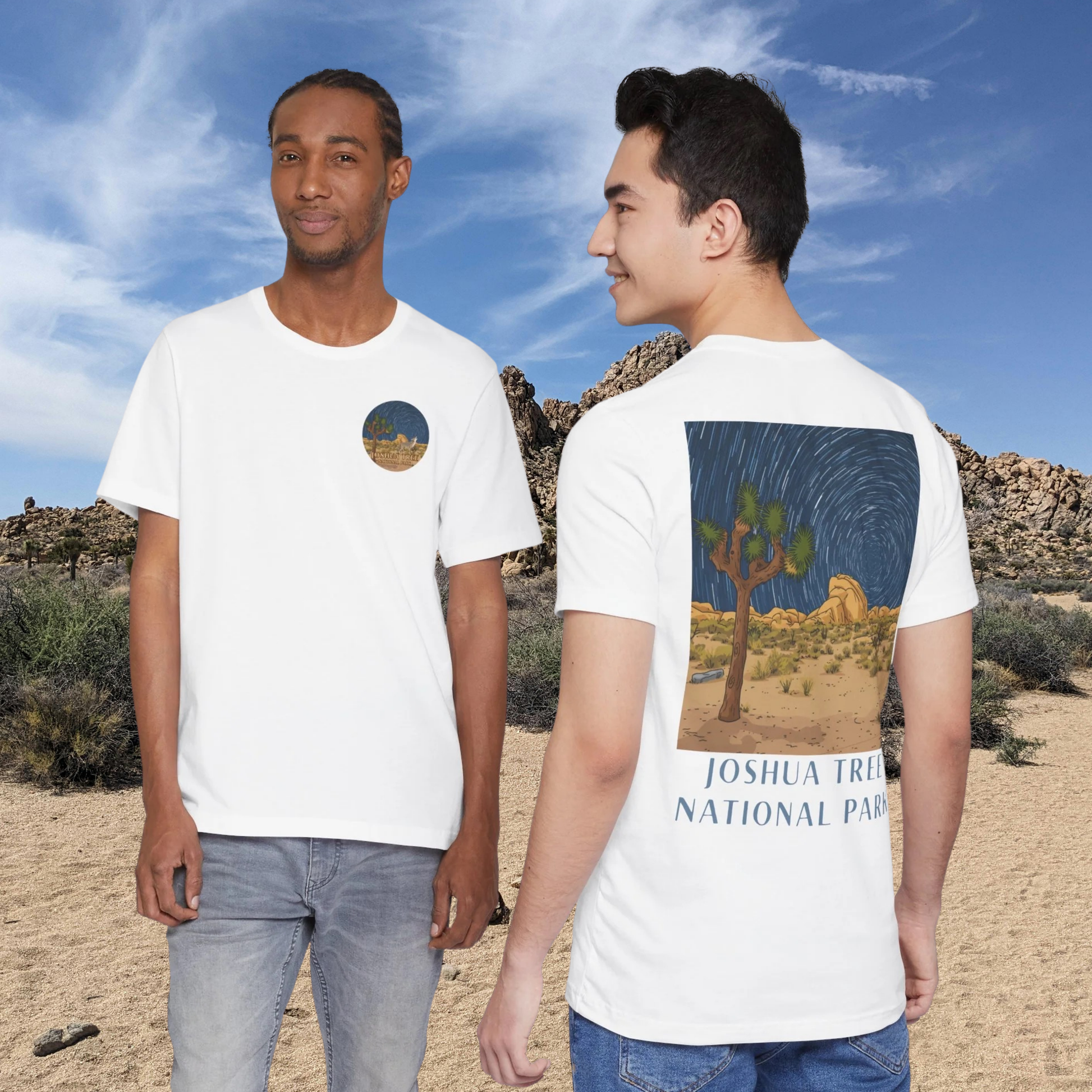 Two people wearing white t-shirts with Joshua Tree National Park designs, standing in a desert landscape.