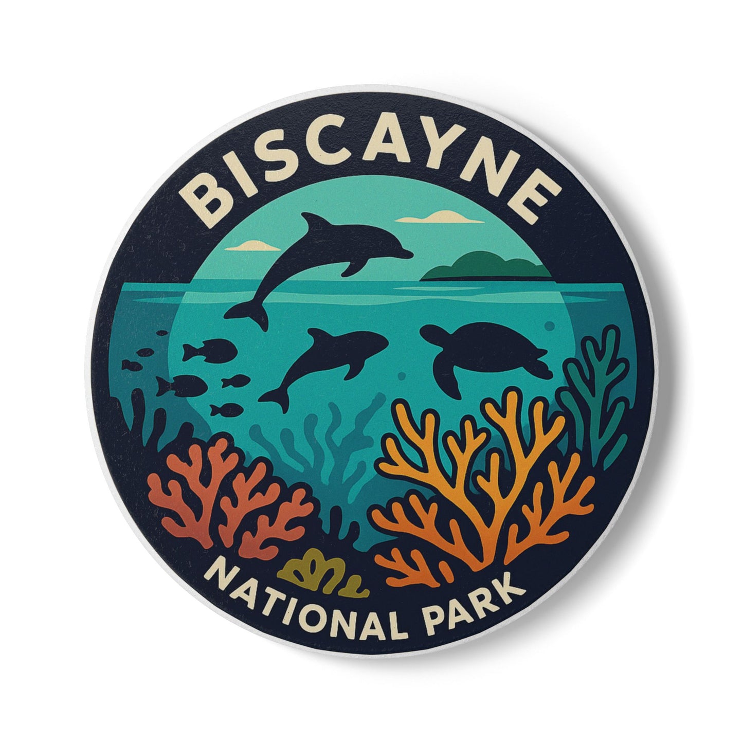 Ceramic coaster with Biscayne National Park design featuring dolphins and a turtle underwater.