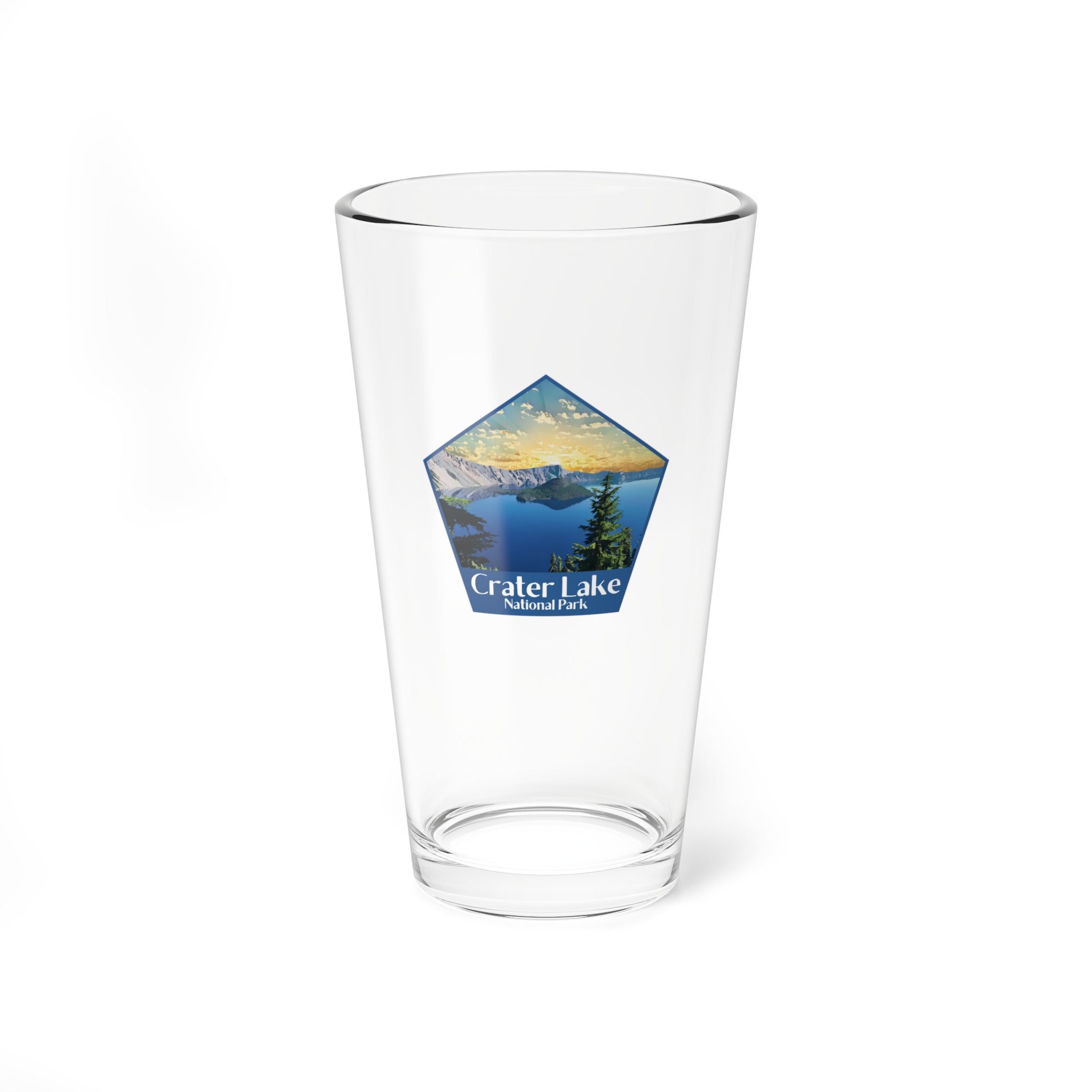 16oz pint glass featuring a pentagon shaped image of a sunrise over Crater Lake and the Text Crater Lake National Park.
