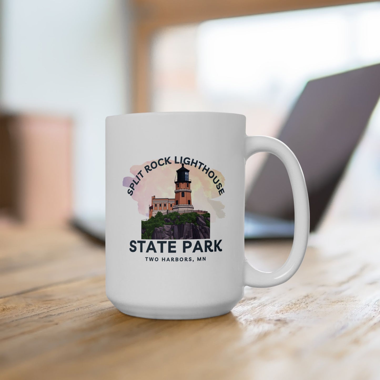 White mug with Split Rock Lighthouse State Park design on a wooden surface
