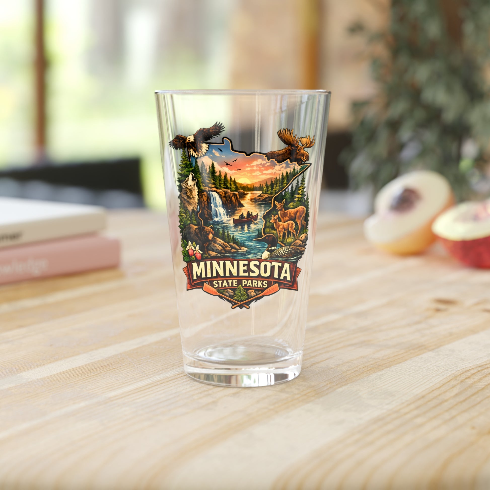 Clear glass with Minnesota State Parks design on a wooden table