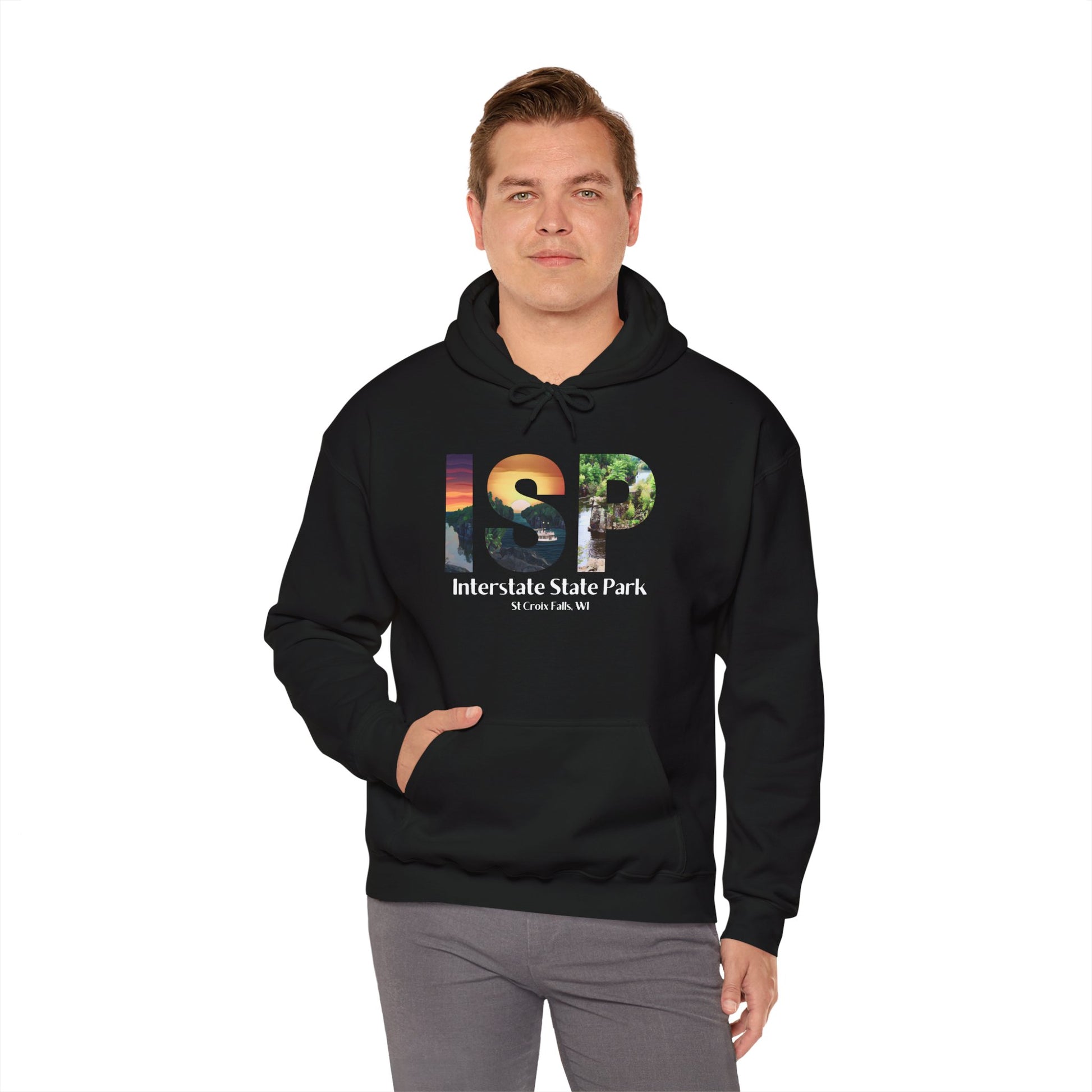 Male wearing a black colored hoodie featuring a ISP logo design with artistic prints and the text: Interstate State Park - St Croix Falls, WI”.  