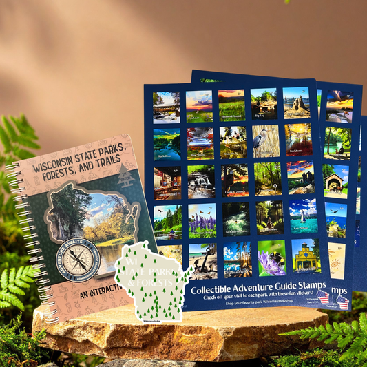 Collectible adventure guide stamps and a notebook on a natural background