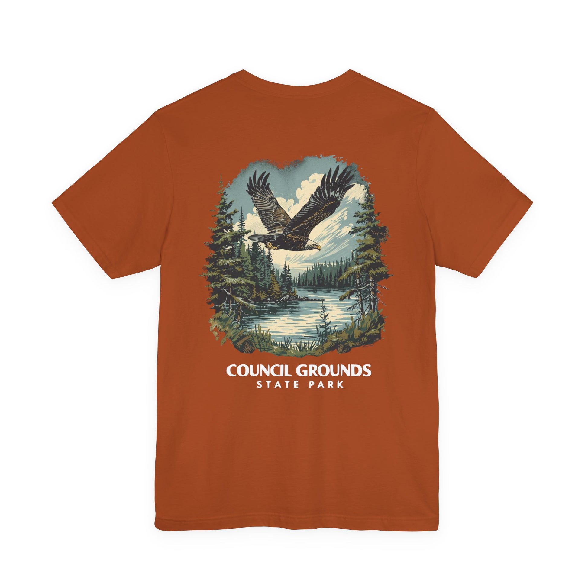 Brown t-shirt with eagle and forest graphic and 'Council Grounds State Park' text on a white background