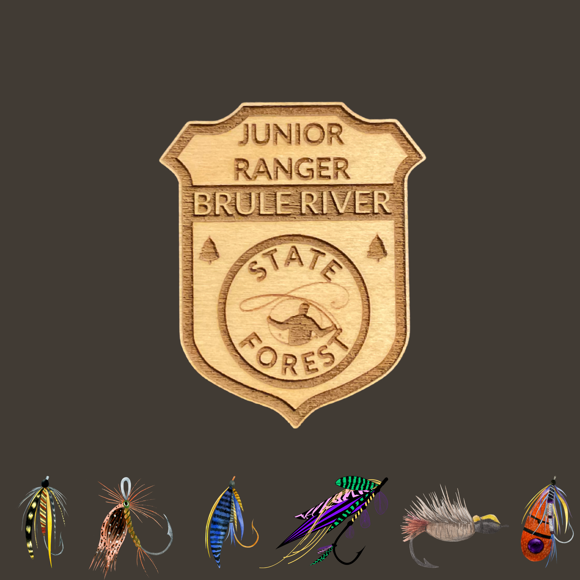 Wood Jr Ranger badge with the text: “Junior Ranger Brule River State Forest” and an icon of a fly fisherman casting.  Photo background: dark grey background with 6 icons of different types of fly fishing flies. 