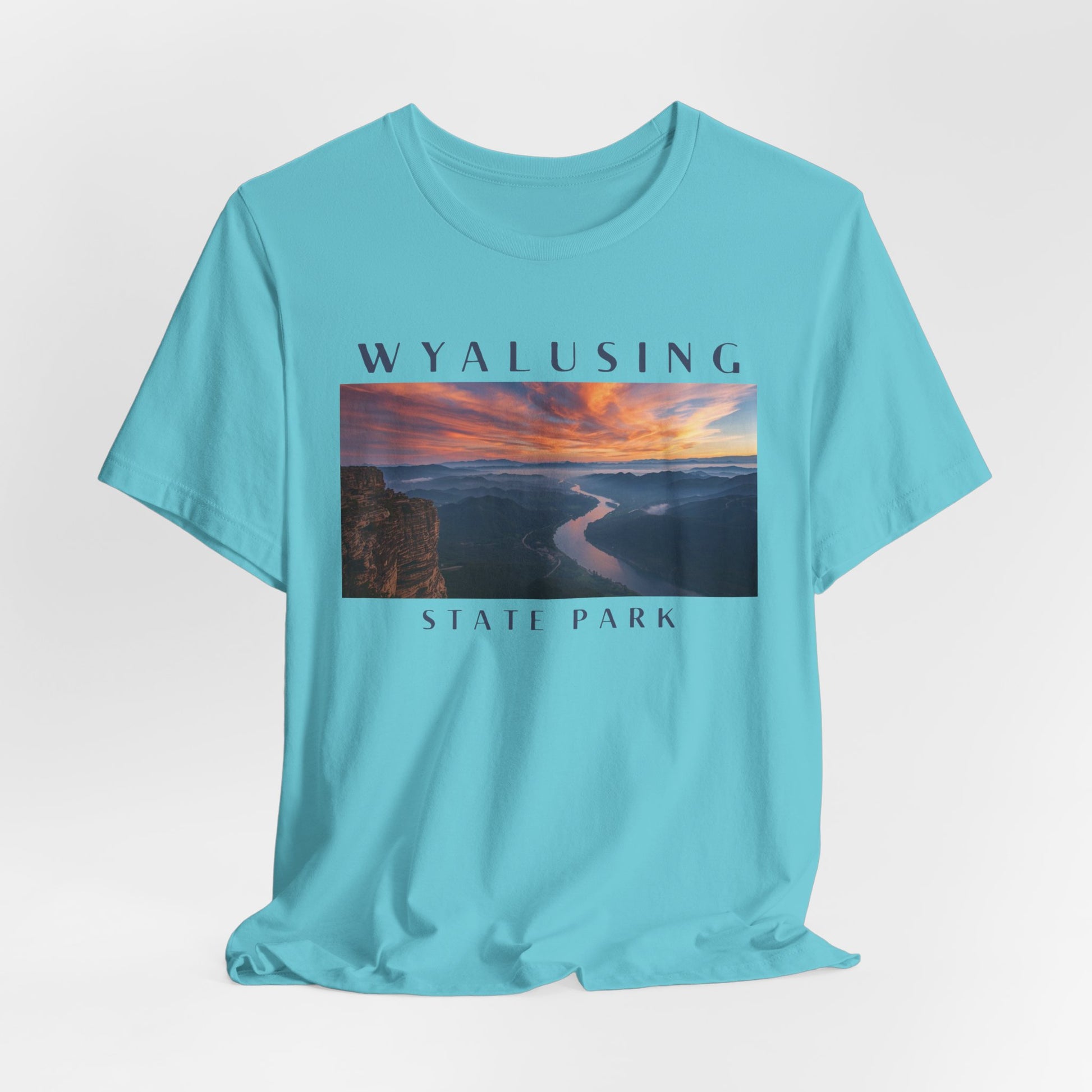 Turquoise t-shirt with Wyalusing State Park graphic on a light gray background